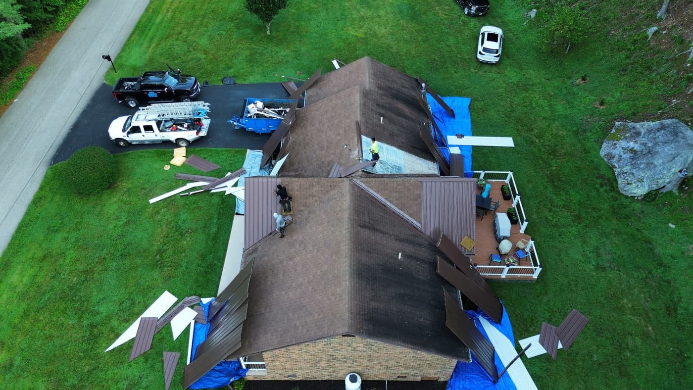 Old metal roof being torn off during a replacement